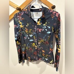 Foray Golf women's full-zip athletic jacket with a floral print